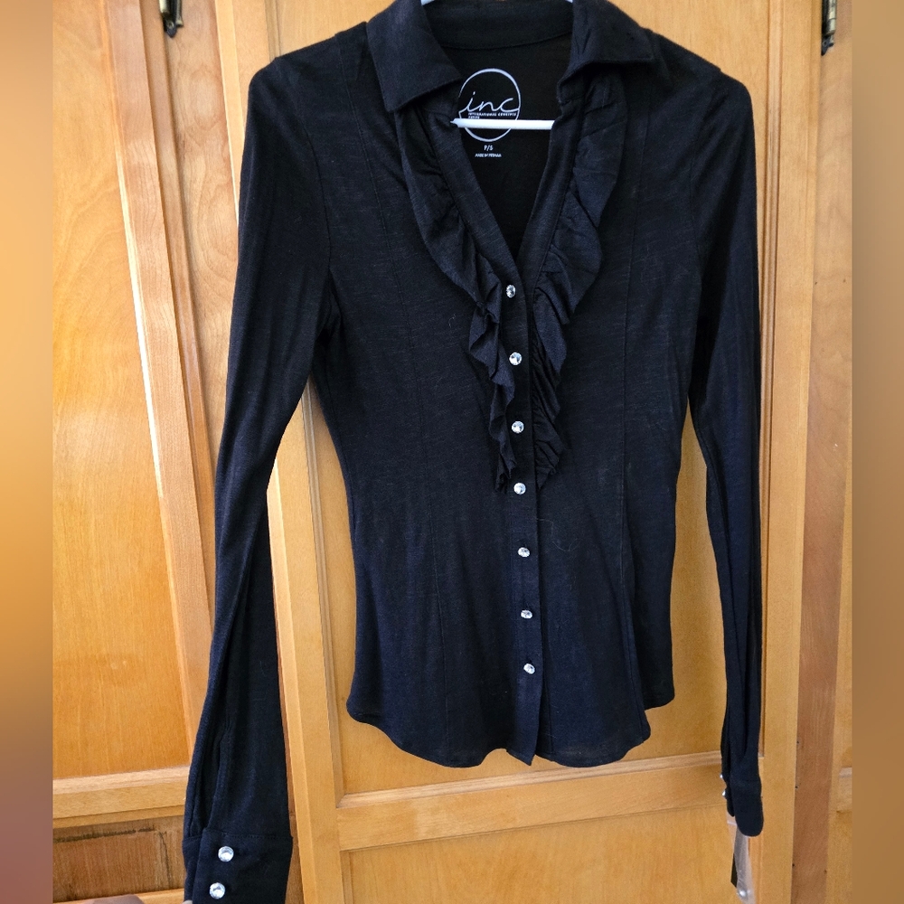 NEW INC ruffle front collared blouse with rhinestone buttons.